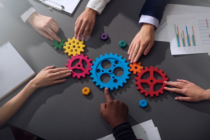 A Guide to Navigating Acquisitions and Divestitures for Oil and Gas Accountants - 1 - Council of Petroleum Accountants Societies A Guide to Navigating Acquisitions and Divestitures for Oil and Gas Accountants - company teamwork gears - Council of Petroleum Accountants Societies
