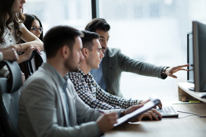 How to Choose the Best Oil and Gas Accounting Software - 2 - Council of Petroleum Accountants Societies How to Choose the Best Oil and Gas Accounting Software - team with software - Council of Petroleum Accountants Societies